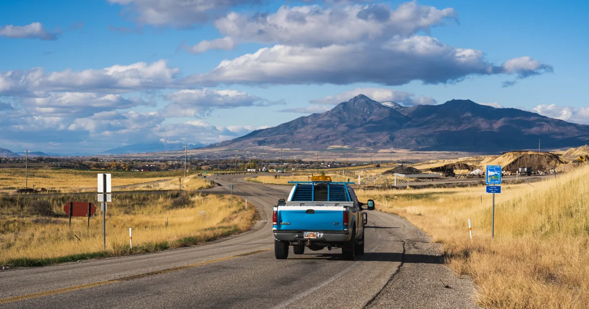 A diesel pickup truck on an open interstate highway