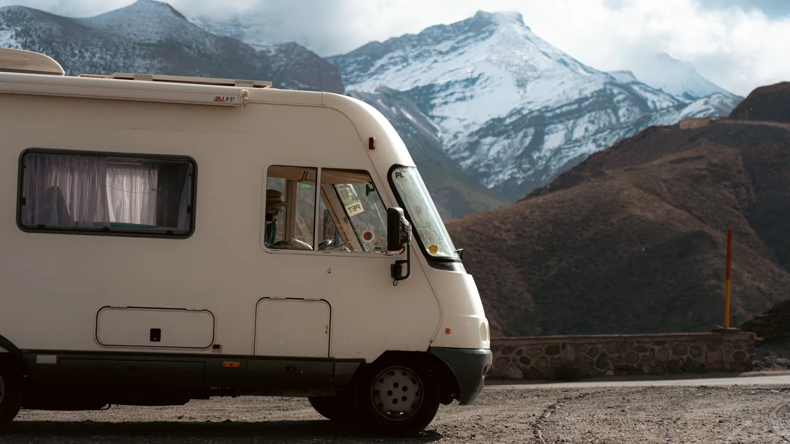A diesel RV motorhome on a mountain road