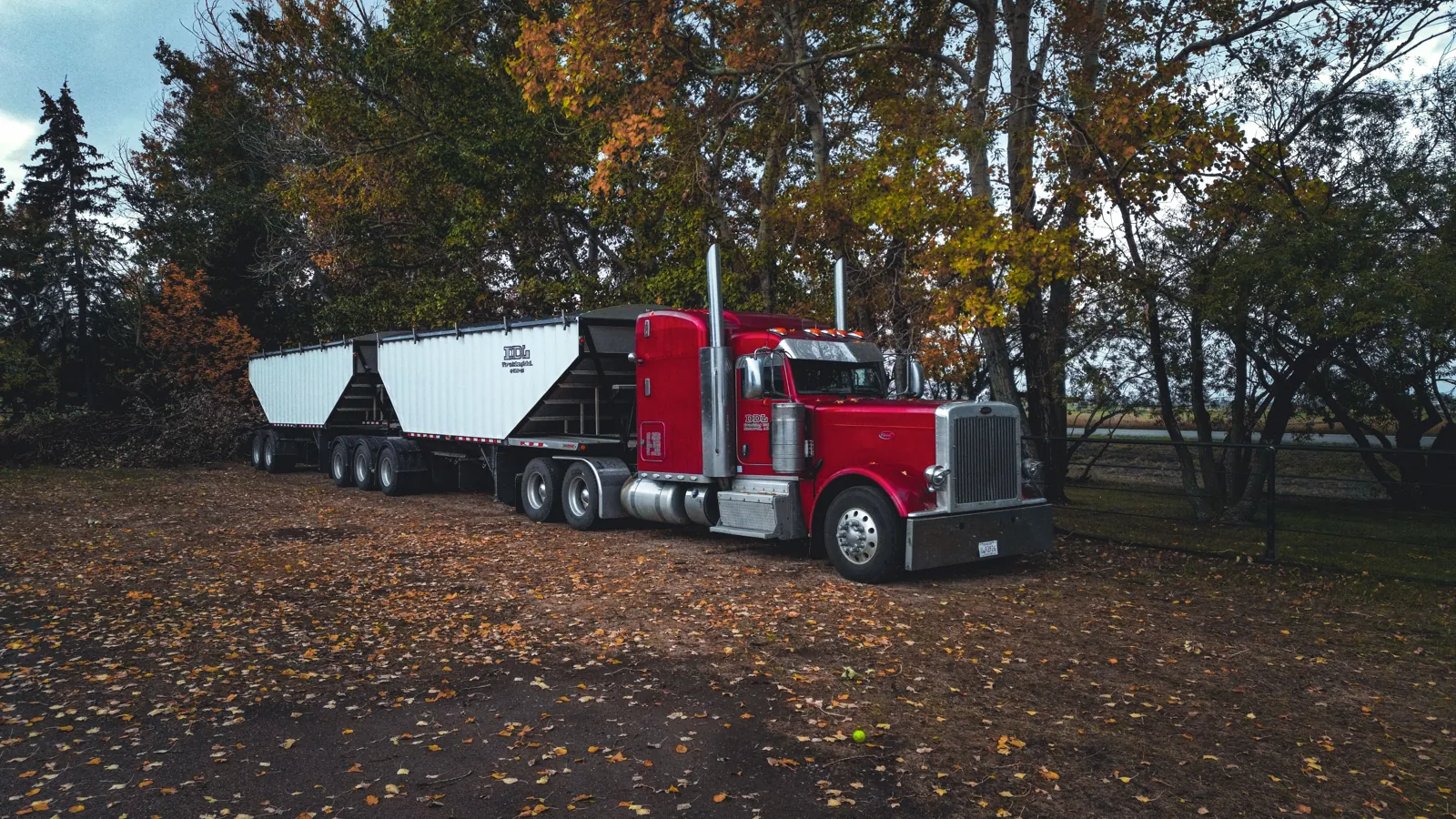 A semi-truck and trailer parked outdoors